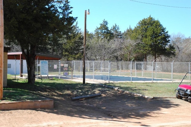 view of pool with tennis court