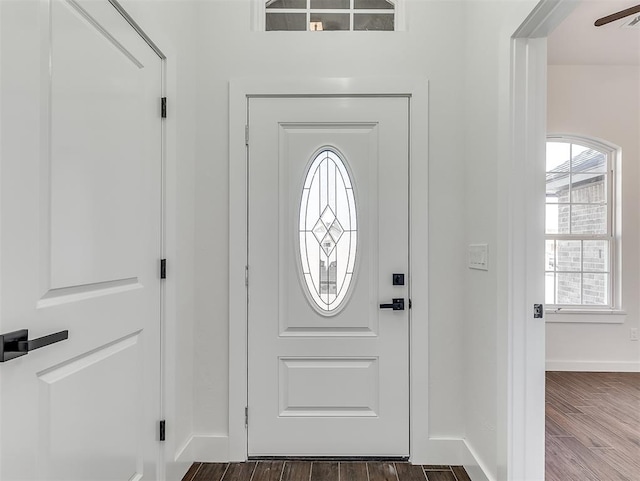 foyer featuring ceiling fan and dark hardwood / wood-style flooring