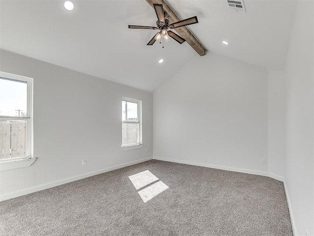 unfurnished room featuring vaulted ceiling with beams, ceiling fan, and carpet floors