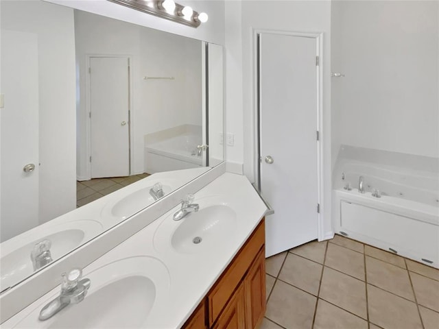 bathroom featuring tile patterned flooring, vanity, and a tub to relax in