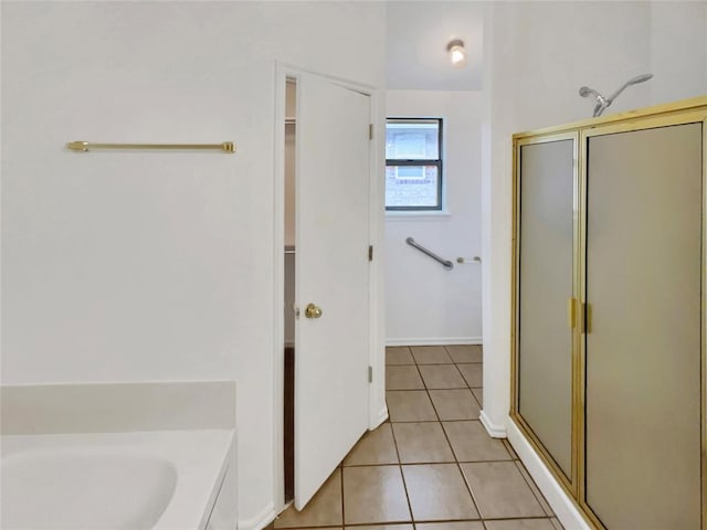 bathroom with tile patterned flooring and plus walk in shower