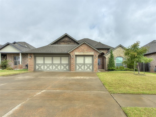 view of front facade with a garage and a front lawn