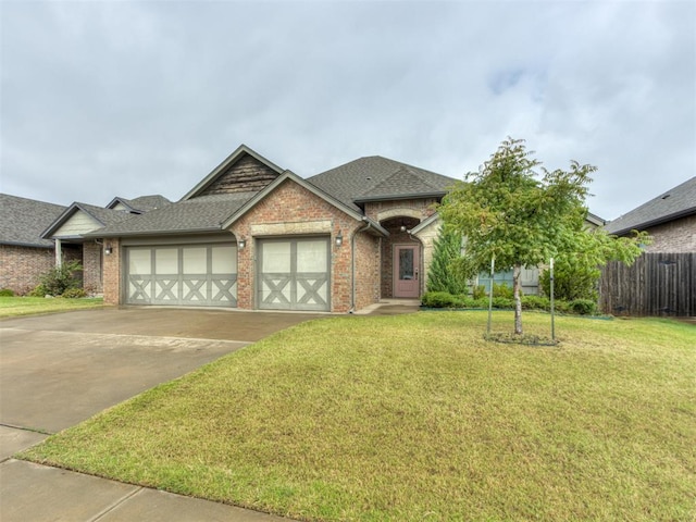 view of front of house with a garage and a front yard