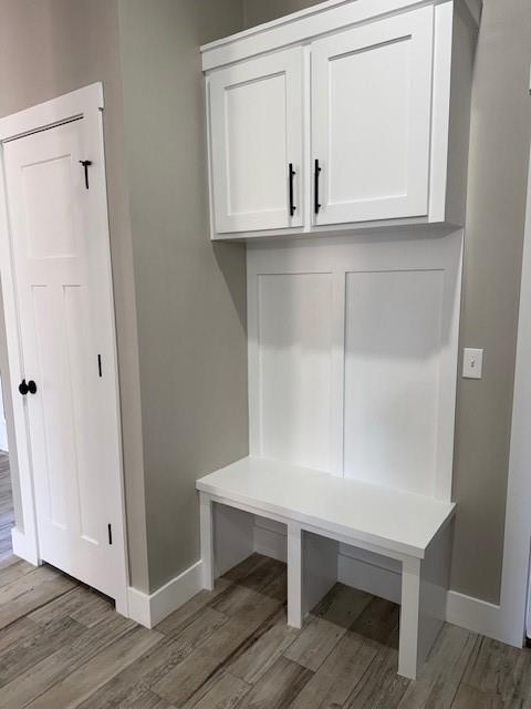 mudroom with wood-type flooring