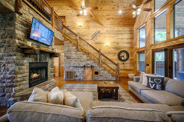 living room with wooden ceiling, hardwood / wood-style flooring, high vaulted ceiling, and wooden walls