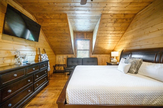 bedroom featuring wood walls, wooden ceiling, lofted ceiling, and light wood-type flooring