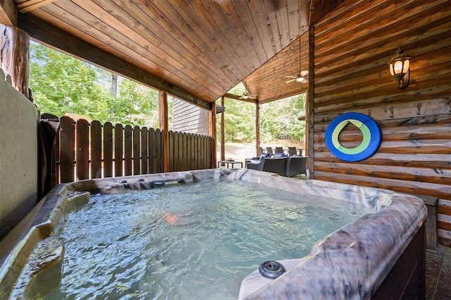 exterior space featuring a hot tub