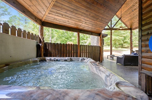 view of patio / terrace with a wooden deck and a hot tub