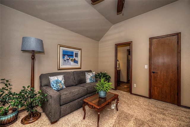 living room with ceiling fan, carpet, and lofted ceiling