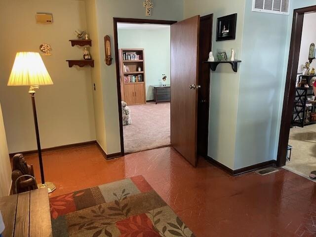 hallway featuring carpet floors