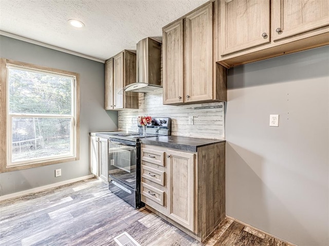 kitchen with decorative backsplash, light wood-type flooring, wall chimney exhaust hood, a textured ceiling, and black range with electric stovetop