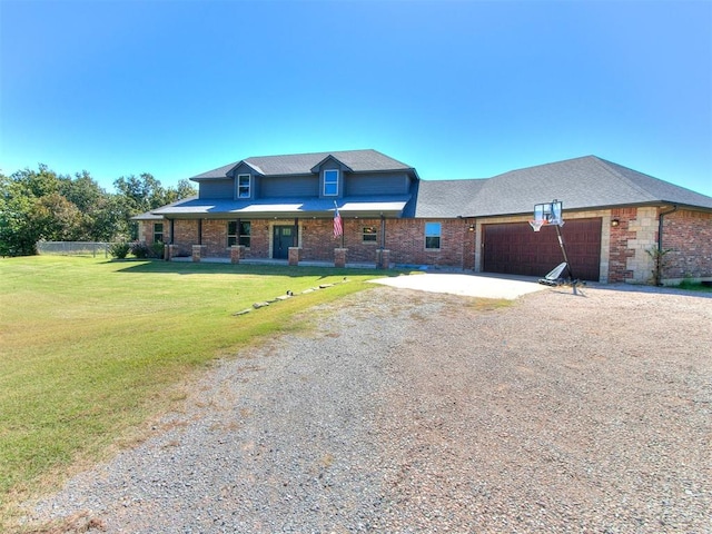 view of front of property featuring a garage and a front lawn