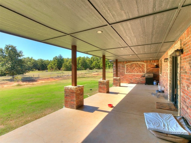 view of patio / terrace featuring a rural view and area for grilling