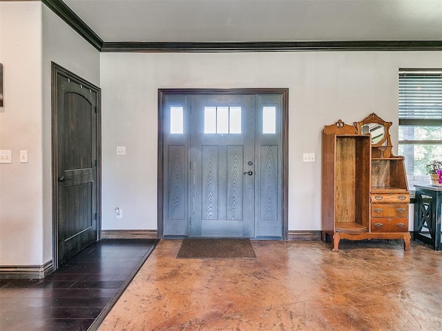 foyer entrance featuring dark hardwood / wood-style floors and ornamental molding