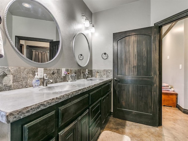 bathroom featuring decorative backsplash and vanity