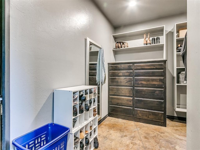 walk in closet featuring light tile patterned floors