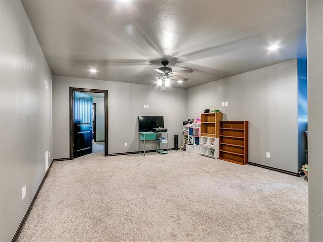 living room with carpet and ceiling fan