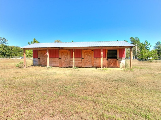 single story home featuring an outbuilding