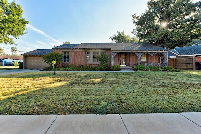 single story home with a garage and a front lawn