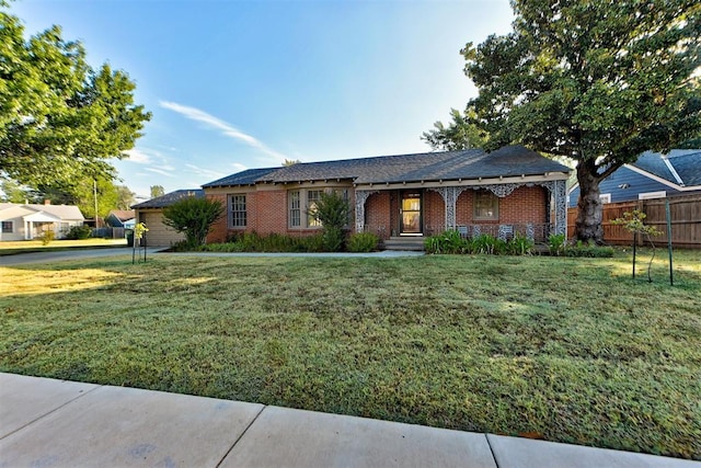 ranch-style house featuring a front lawn