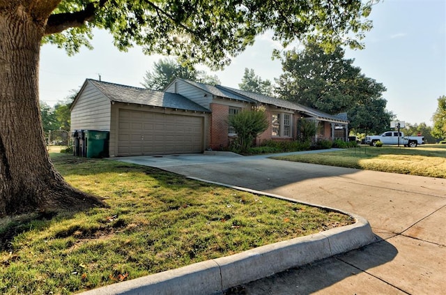 ranch-style house featuring a garage and a front yard