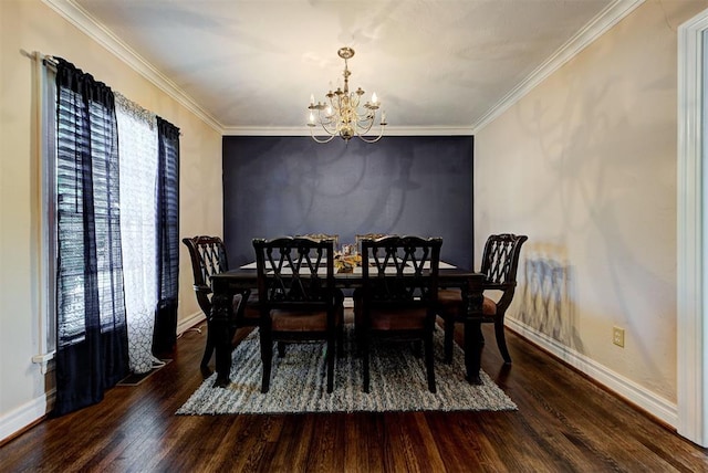 dining area with dark hardwood / wood-style flooring, a chandelier, and ornamental molding