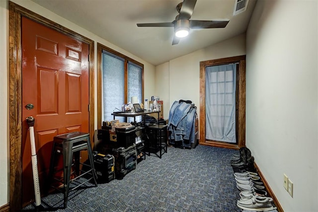 carpeted office featuring ceiling fan and vaulted ceiling