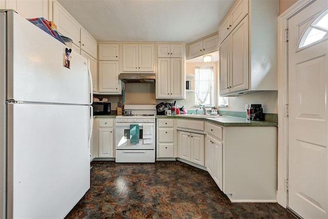 kitchen with cream cabinets, sink, and white appliances