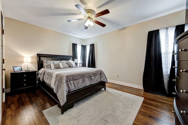 bedroom featuring ceiling fan and dark hardwood / wood-style flooring