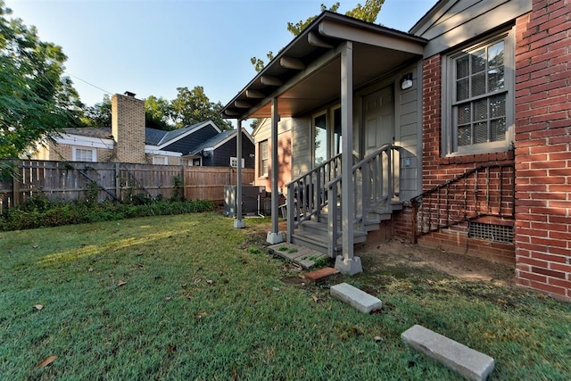 view of side of home with a lawn