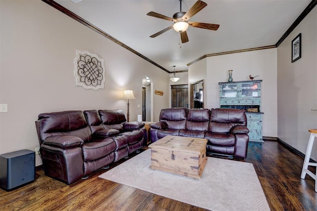 living room with dark hardwood / wood-style flooring, ceiling fan, and ornamental molding