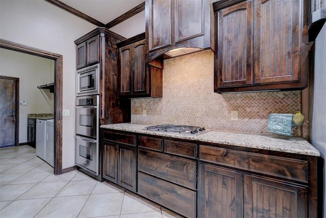 kitchen featuring light stone countertops, dark brown cabinetry, ornamental molding, and appliances with stainless steel finishes