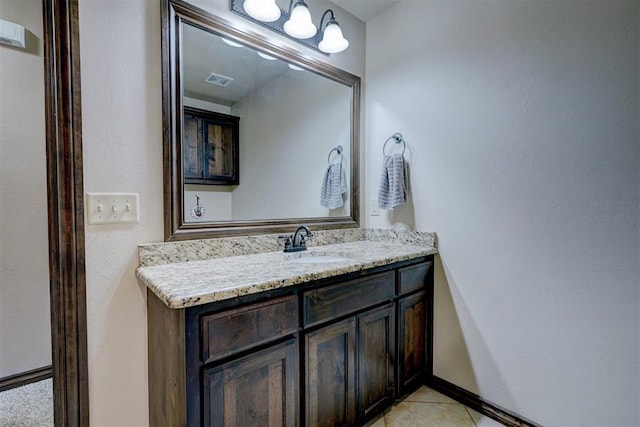 bathroom with tile patterned flooring and vanity