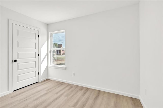 spare room featuring light hardwood / wood-style flooring