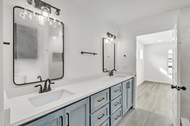 bathroom with hardwood / wood-style floors and vanity