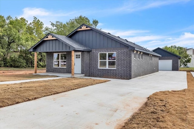 view of front of home with an outbuilding and a garage