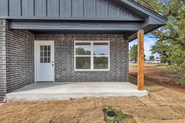 property entrance with a patio