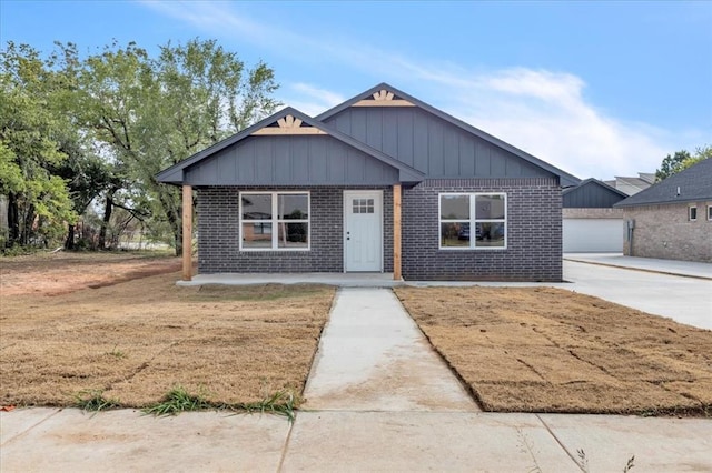 view of front of house with an outbuilding and a garage