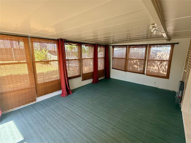 unfurnished sunroom featuring a wealth of natural light