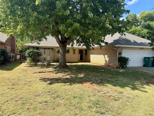 view of front facade with a front lawn and a garage