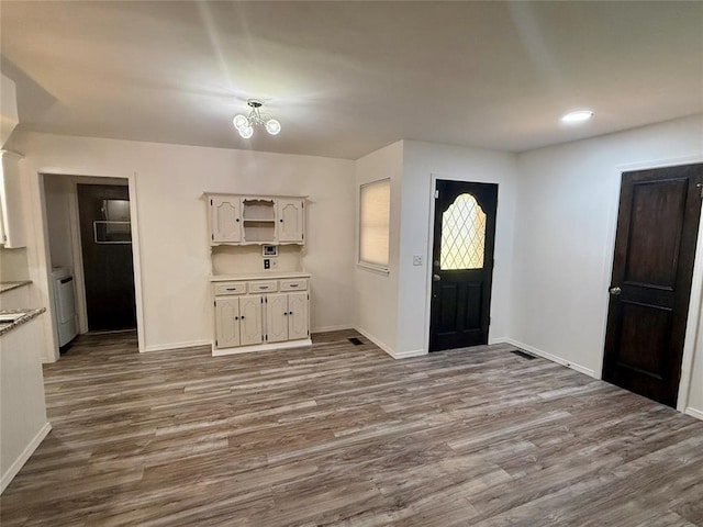 foyer entrance with wood-type flooring