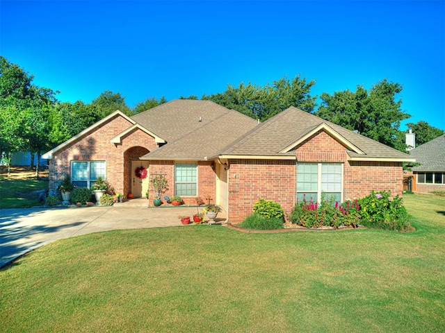 ranch-style house with a front lawn