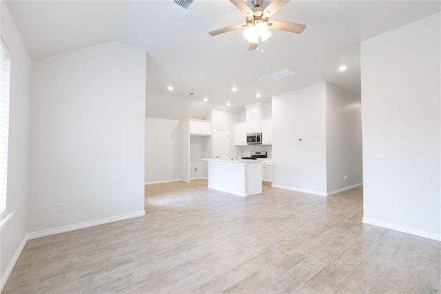 unfurnished living room featuring visible vents, ceiling fan, recessed lighting, light wood-style flooring, and lofted ceiling