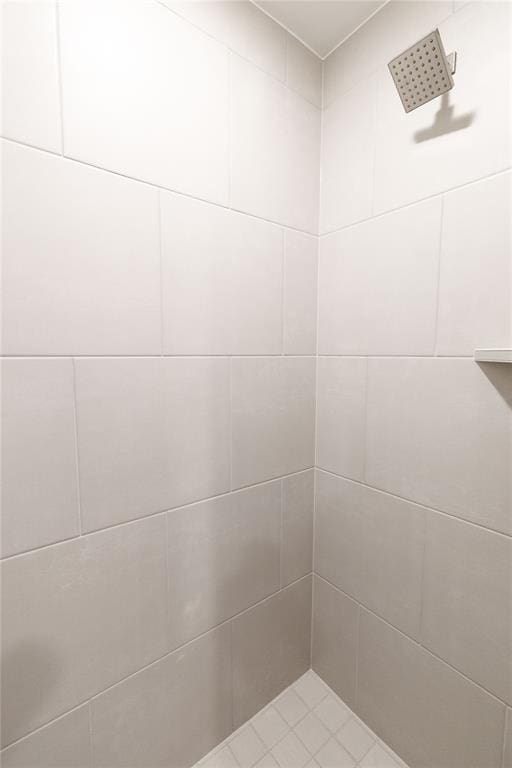 full bath featuring a tile shower