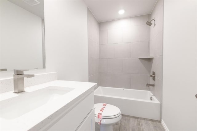 bathroom featuring vanity,  shower combination, toilet, visible vents, and wood finished floors