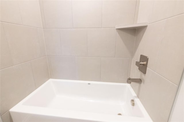 bathroom with a bathtub and walk in shower