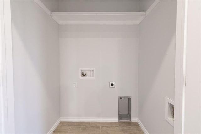 laundry room with laundry area, washer hookup, baseboards, and electric dryer hookup