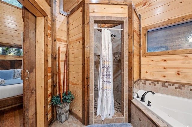 bathroom with separate shower and tub and wooden walls