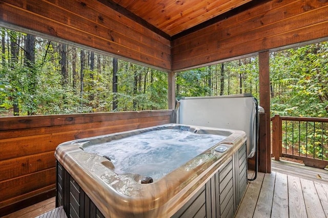 wooden terrace featuring a hot tub