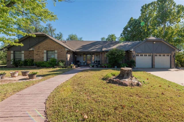 single story home featuring a front yard and a garage